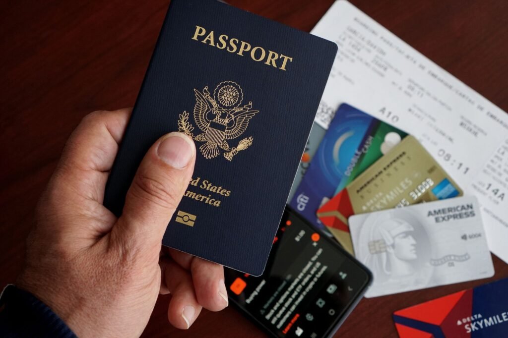 close up of us passport with travel essentials