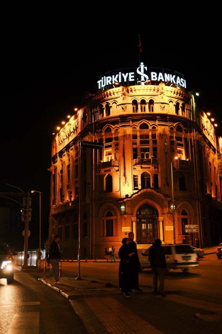 turkiye bankasi illuminated at night in istanbul