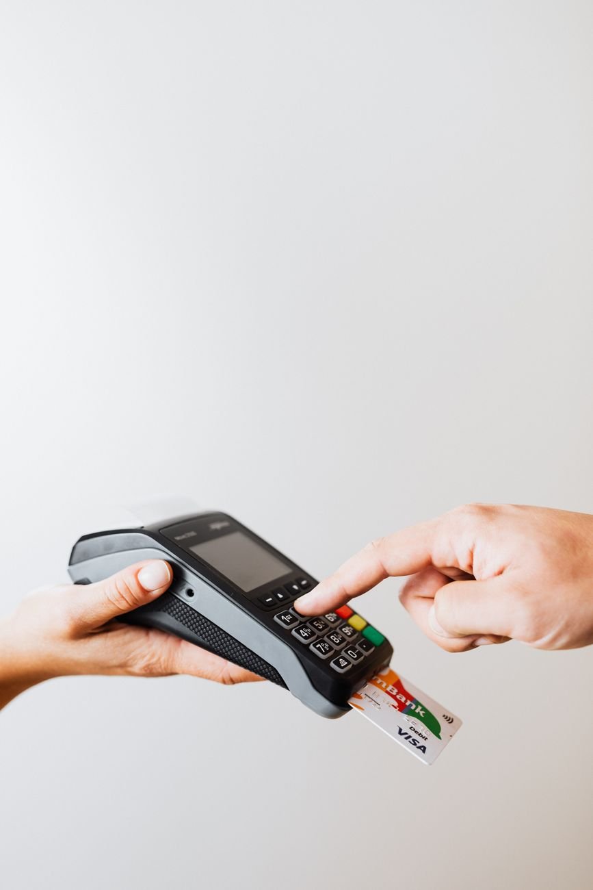 a person pressings on the payment terminal keypad