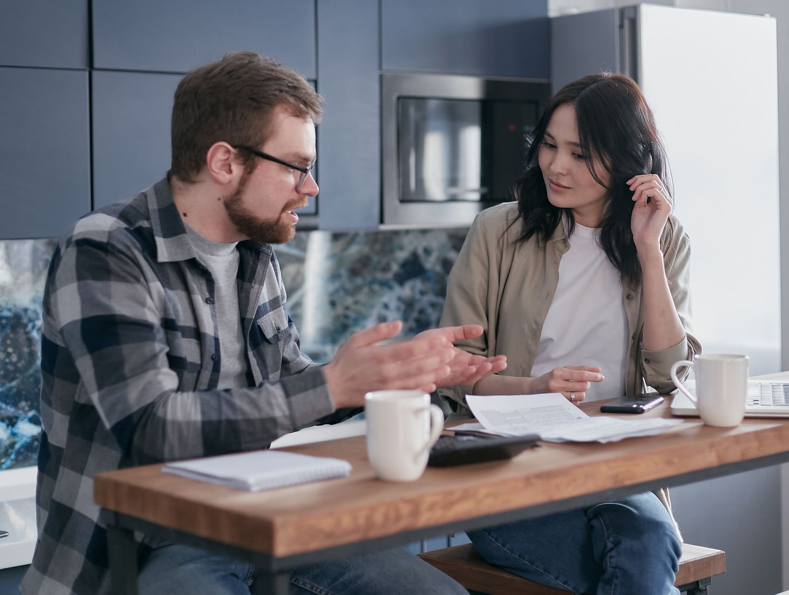 man and woman sitting at table