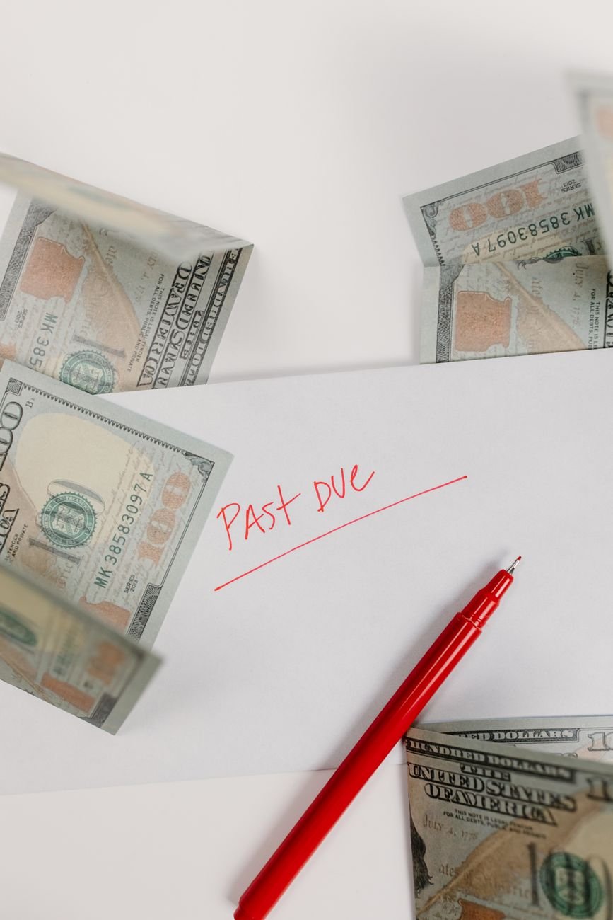 close up shot of money beside a pen