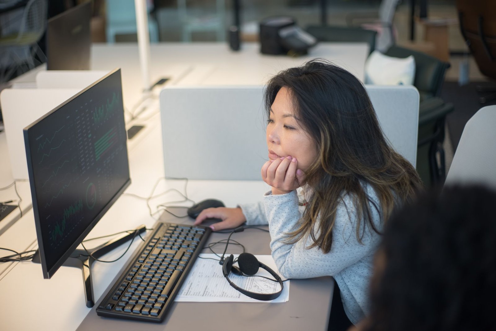 a woman sitting by the computer