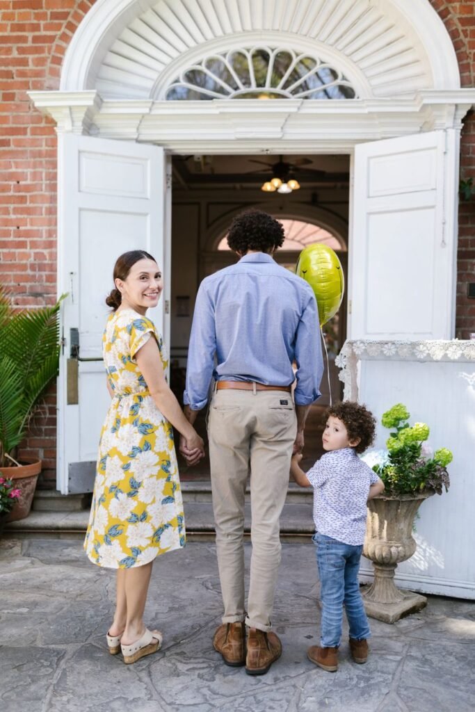 back view of a family holding hands