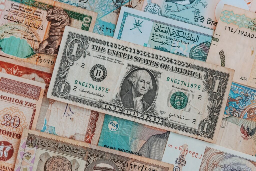Top view of assorted paper money with American greenback representing image of President and numbers with words and signature on bill